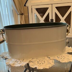 Elegant Cream Metal Storage Bin with Handles, earthy green color on the inside.